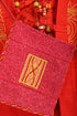 Small cross body bag with embroidered badge